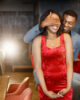 Black man gifted a gift box for his girlfriend. Woman wearing red elegant dress and man blue costume. Man standing behind of his girlfriend.